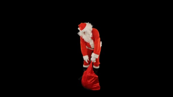 Święty Mikołaj Torbą Pełną Prezentów Pstryka Palcami Aby Stworzyć Magię — Wideo stockowe
