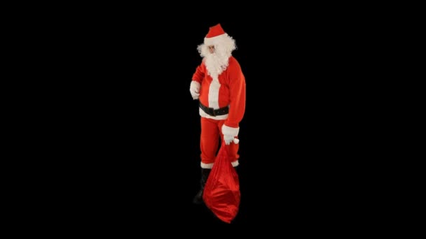 Weihnachtsmann Mit Einer Tüte Voller Geschenke Verloren Und Verwirrt Wirkend — Stockvideo