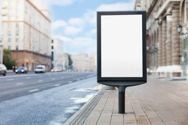 stock image An empty billboard stands on a quiet urban street, street view at daytime, template