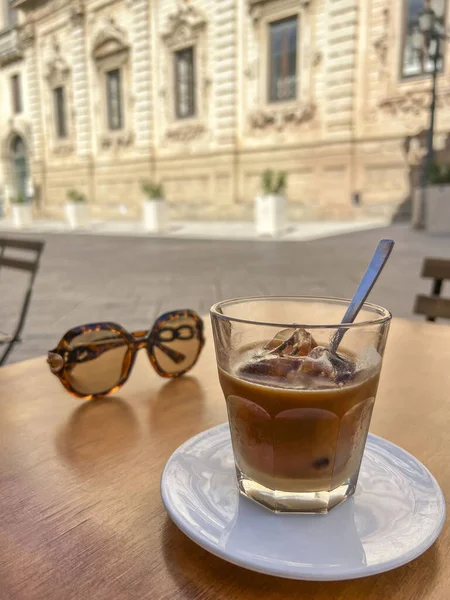 coffee, top view glass of cold iced esspresso coffee with almond milk known as leccese in Lecce, Italy. traditional cold drink or local beverage of Lecce in Italy.