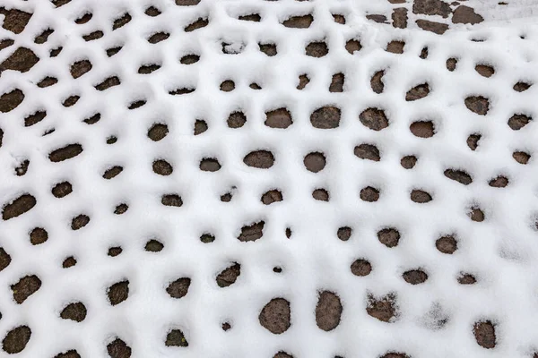 Kopfsteinpflaster Mit Schnee Bedeckt Natürlicher Hintergrund Nahaufnahme — Stockfoto