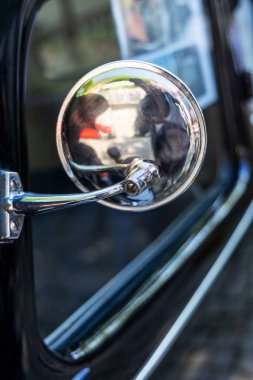 Rearview mirror on a retro car close-up