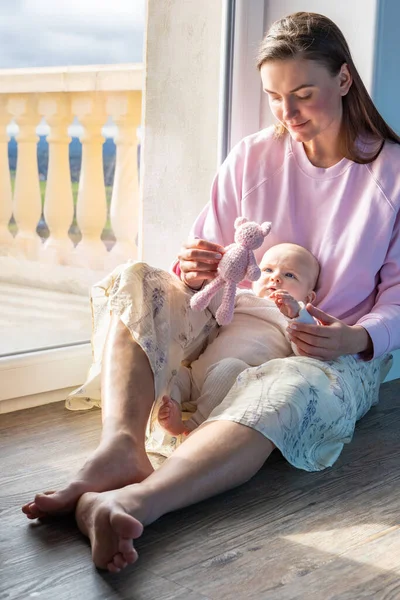 Mother Plays Child Sitting Floor Window — Stock Photo, Image