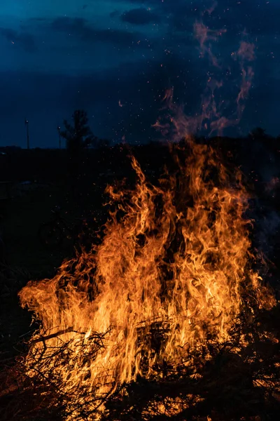 Bonfire burning in the yard at night, beautiful texture of burning fire