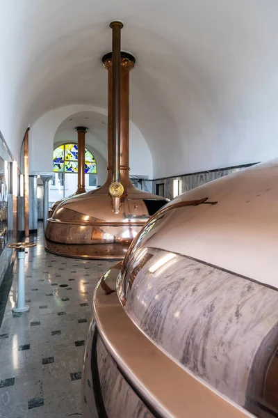 Brewery, copper vats with beer. View of beer brewery interior with traditional fermenting copper vats. Modern brewery. Craft beer production line. Copper tanks for brewing
