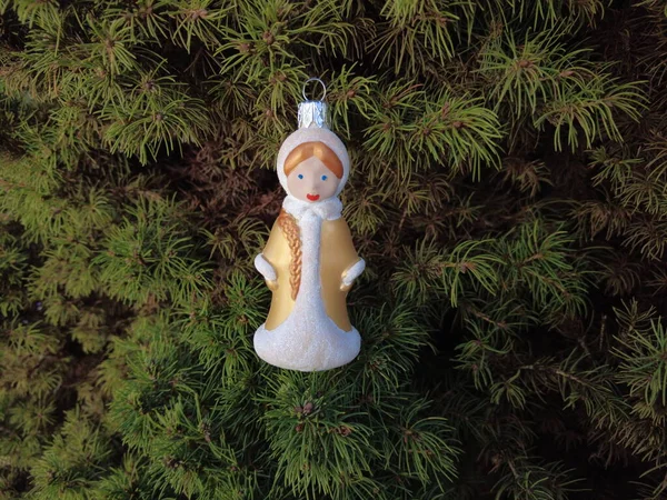 toy snowman. snow woman. New Year. Christmas fairy. Christmas tree. vintage christmas toys. Snowman and christmas balls on snow. winter holidays.