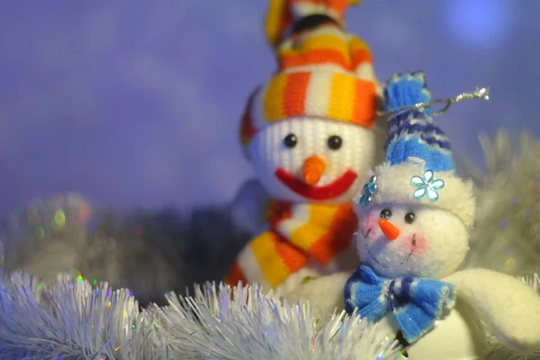 snowman toy. christmas snowman. Happy snowman family in the snow. snowman and christmas ball on snow