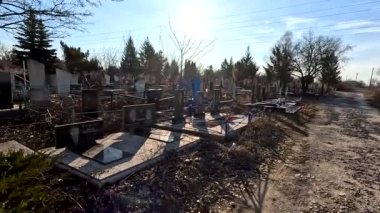 Ukrina. January 11, 2023. Old cemetery. Abandoned graves. Broken headstones. Fresh graves. footage in high quality. 4k video