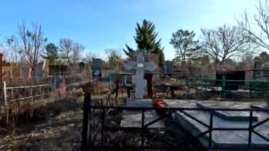 Ukrina. January 11, 2023. Old cemetery. Abandoned graves. Broken headstones. Fresh graves. footage in high quality. 4k video