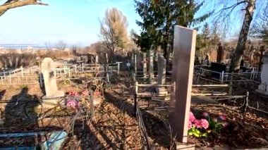 Ukrina. January 11, 2023. Old cemetery. Abandoned graves. Broken headstones. Fresh graves. footage in high quality. 4k video