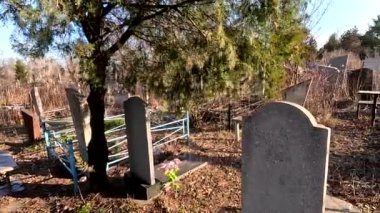 Ukrina. January 11, 2023. Old cemetery. Abandoned graves. Broken headstones. Fresh graves. footage in high quality. 4k video