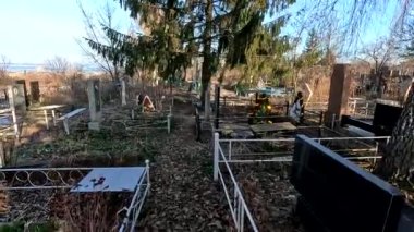 Ukrina. January 11, 2023. Old cemetery. Abandoned graves. Broken headstones. Fresh graves. footage in high quality. 4k video
