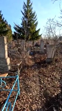 Ukrina. January 11, 2023. Old cemetery. Abandoned graves. Broken headstones. Fresh graves. footage in high quality. 4k video