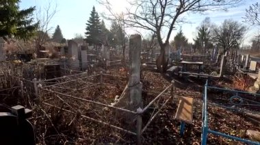 Ukrina. January 11, 2023. Old cemetery. Abandoned graves. Broken headstones. Fresh graves. footage in high quality. 4k video
