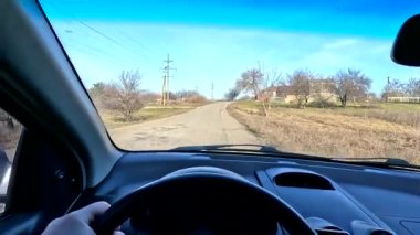 car ride in first person. footage in high definition. car with internal combustion engine. bad road. holes in the road.