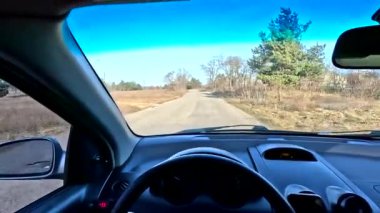 car ride in first person. footage in high definition. car with internal combustion engine. bad road. holes in the road.