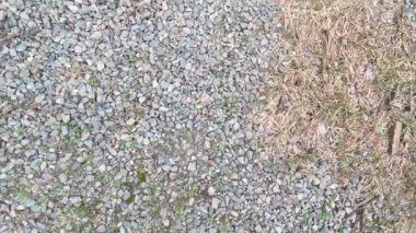 rubble. small pebbles. road texture. Shooting rubble close-up on the street, crushed stone. A large pile of rubble is lying on the street at a construction site. gray stones.