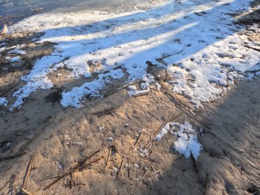snow on white sand. sand and snow.