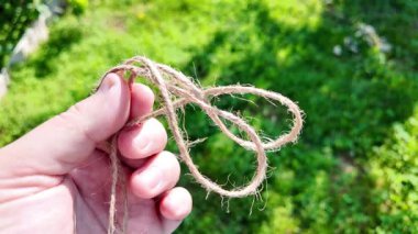 Felaket. Doğal Jute Twine dokusu. Doğal jüt sicimin yüksek çözünürlüklü dokusu pürüzlü liflerini ve organik dokumasını gösteriyor. Elde bela. Jute çuval bezi rustik ip ipi ipi ipi.