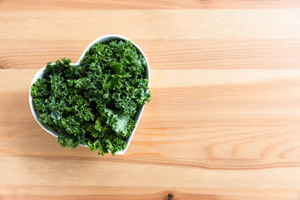 Flat Lay Fresh Raw Kale Heart Shaped Bowl Copy Space Stockbild