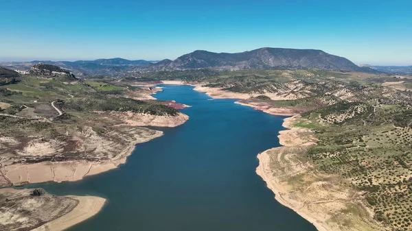 stock image AERIAL - Zahara de la Sierra and its lake, Cadiz, Spain