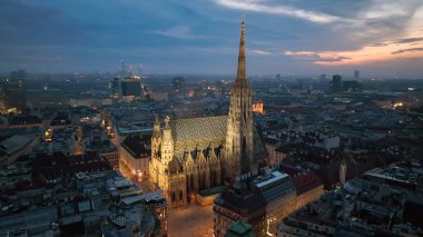 Aerial view of famous places St. Stephens Cathedral Stephansdom at night. Mother church of the Roman Catholic Archdiocese of Vienna. Austria clipart