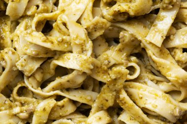 close up of italian basil pesto pasta food background