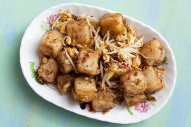 Bir tabak Çin Dim Sum 'un en sevdiği kızarmış turplu pastayı yakın. 