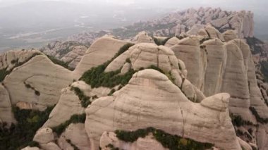 Flight over the mountains of Montserrat in Spain. High quality 4k footage