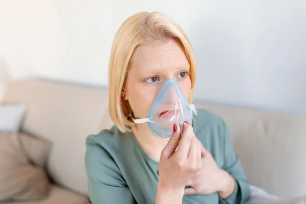 Sick woman on oxygen mask inhalation, pneumonia coronavirus pandemic. ill woman wearing an oxygen mask and undergoing treatment. covid 19