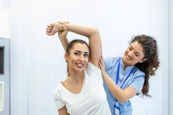 Doctor Physiotherapist Working Examining Treating Injured Arm Athlete Patient Stretching — Stock Photo, Image