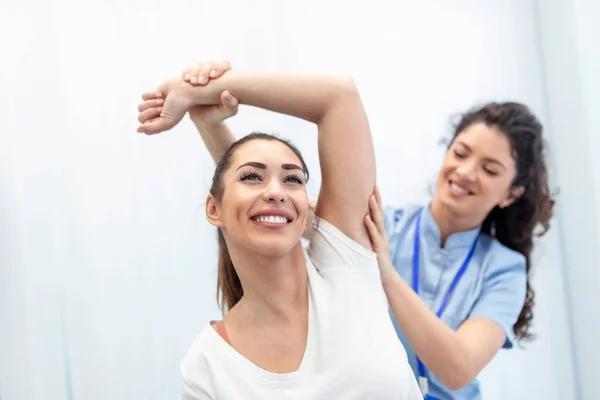 Doctor Physiotherapist Working Examining Treating Injured Arm Athlete Patient Stretching — Stock Photo, Image
