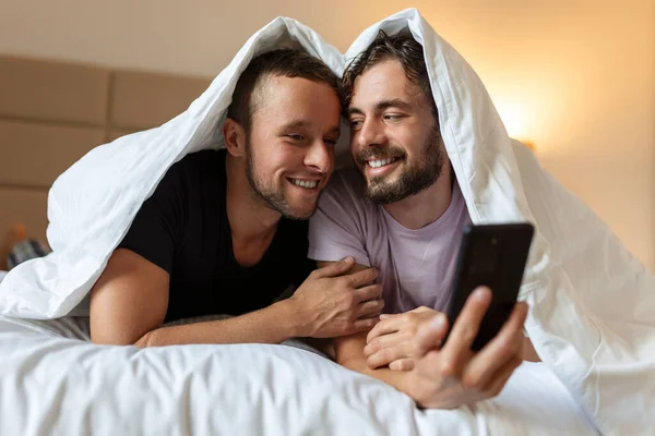 stock image Happy gay couple having tender moments in bedroom - Homosexual love relationship and gender equality concept