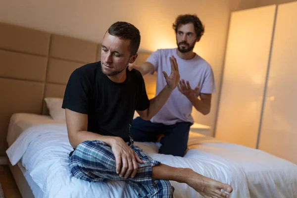 stock image Young Gay LGBTQ couple having relationship difficulties and arguing at home.