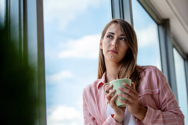 Attractive Businesswoman Drinking Coffee While Standing Window Office Overlooking City — Stock Photo, Image