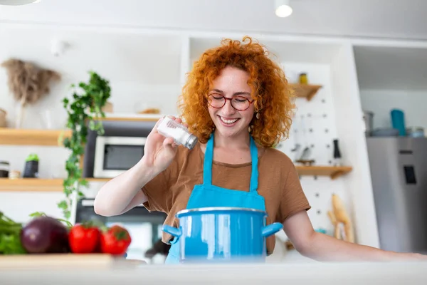 Cute Young Woman Cooking Adding Spice Meal Laughing Spending Time — Stock Photo, Image