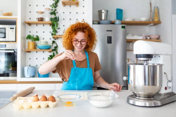 stock image Baking Concept. Portrait Of Joyful Woman Kneading Dough In Kitchen Interior, Cheerful Female In Apron Having Fun While Preparing Homemade Pastry,