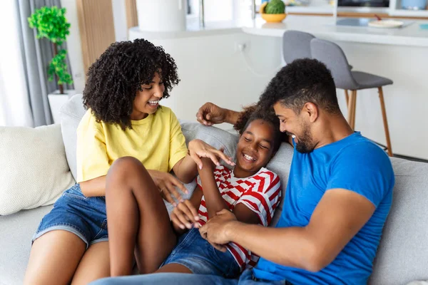 Happy Multiethnic Family Sitting Sofa Laughing Together Cheerful Parents Playing — Stock Photo, Image