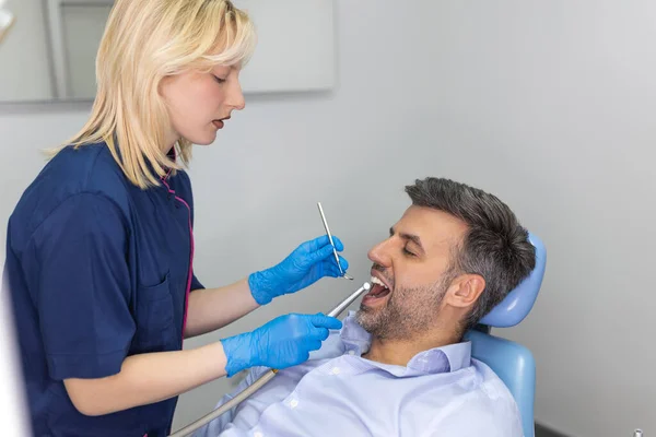 Female Dentist Curing Teeth Cavity Blue Gloves Dentist Caries Treatment — Stock Photo, Image