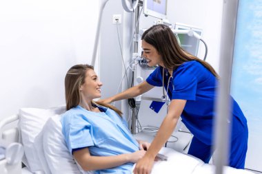 Young patient on bed talking to female doctor in hospital room, Health care and insurance concept. Doctor comforting patient in hospital bed or counsel diagnosis health. clipart