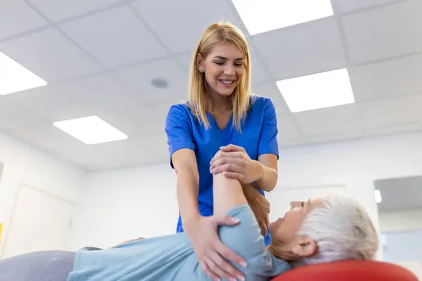 Doctor Physiotherapist Helps Heal Senior Woman Back Give Advice Rehabilitation — Stock Photo, Image