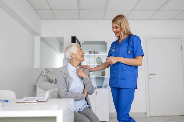 Healthcare and medical concept - doctor with patient in hospital. Doctor working in the office and listening to the patient, she is explaining her symptoms, health care and assistance concept