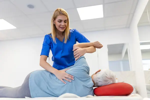 Senior Patient Undergoing Physical Therapy Clinic Recover Surgery Increase Mobility Royalty Free Stock Photos