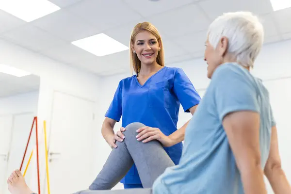 Physiotherapist Working Patient Clinic Closeup Modern Rehabilitation Physiotherapy Worker Senior Royalty Free Stock Images