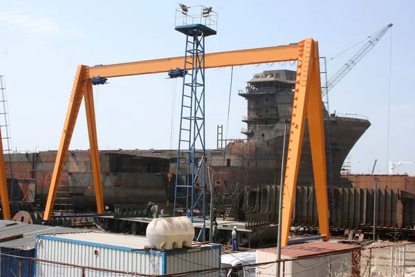 stock image Shipbuilding pier and crane. Workers working on the pier.