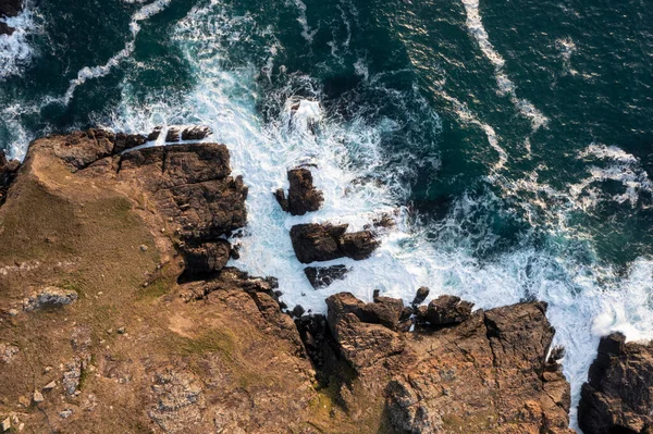 stock image Beautiful aerial drone landscape image of bird's eye view of waves crashing over rocks at shore