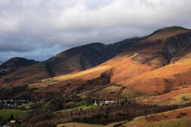 Beautiful sunrise golden hour light on the slopes of Skiddaw in the English Lake District