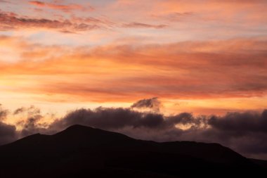 Absolutely stunning landscape image of view across Derwentwater from Latrigg Fell in lake District during Winter beautiful colorful sunset 