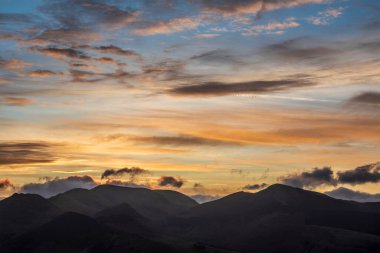 Absolutely stunning landscape image of view across Derwentwater from Latrigg Fell in lake District during Winter beautiful colorful sunset 