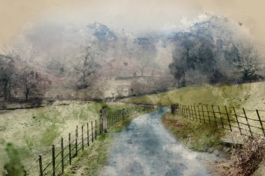 Beautiful Winter landscape image of road around Loughtrigg Tarn on misty morning with calm water and foggy countryside in the background clipart